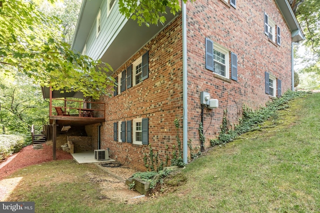 126 Armstrong Pl, Winchester, VA 22602 - view of property exterior featuring a lawn, a deck, central AC, brick siding, and stairs