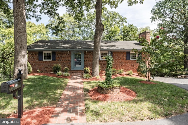 126 Armstrong Pl, Winchester, VA 22602 - single story home featuring a front yard, brick siding, and a chimney