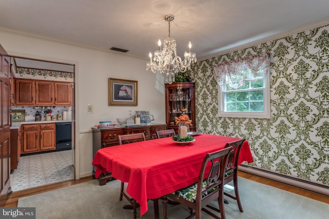 126 Armstrong Pl, Winchester, VA 22602 - dining room featuring visible vents, light wood-style floors, a baseboard heating unit, crown molding, and a chandelier