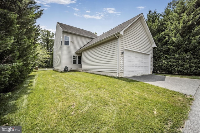 7208 Cherry Ln, Laurel, MD 20707 - view of home's exterior with a yard, an attached garage, asphalt driveway, and a shingled roof
