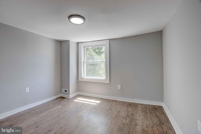 1843 W Pratt St, Baltimore, MD 21223 - spare room with wood finished floors and baseboards