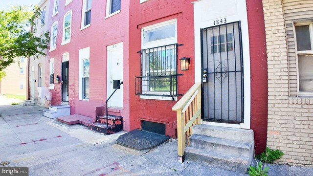 1843 W Pratt St, Baltimore, MD 21223 - entrance to property with brick siding