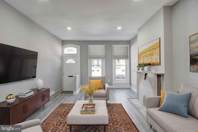 1843 W Pratt St, Baltimore, MD 21223 - living area featuring light wood-style flooring, baseboards, and recessed lighting