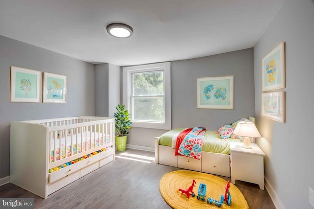 1843 W Pratt St, Baltimore, MD 21223 - bedroom featuring baseboards and wood finished floors