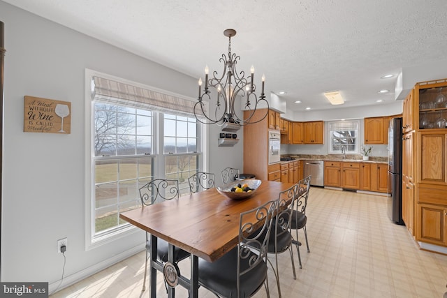 4204 Old Fincastle Rd, Fincastle, VA 24090 - dining room featuring baseboards, a chandelier, light floors, recessed lighting, and a textured ceiling