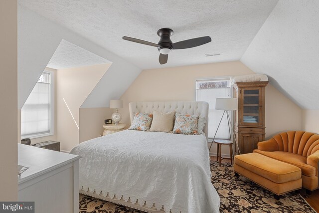 4204 Old Fincastle Rd, Fincastle, VA 24090 - bedroom with visible vents, a textured ceiling, lofted ceiling, and wood finished floors