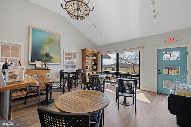4204 Old Fincastle Rd, Fincastle, VA 24090 - dining room with a chandelier, track lighting, high vaulted ceiling, and wood finished floors