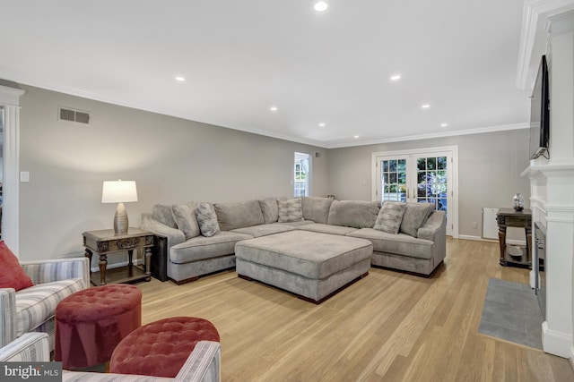 3313 Midland Rd, Fairfax, VA 22031 - living area with light wood finished floors, recessed lighting, a fireplace with flush hearth, visible vents, and ornamental molding