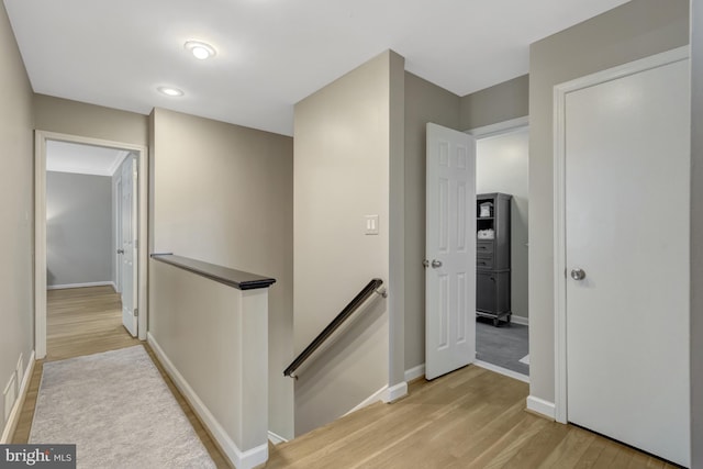 3313 Midland Rd, Fairfax, VA 22031 - corridor with baseboards, an upstairs landing, and light wood-style flooring