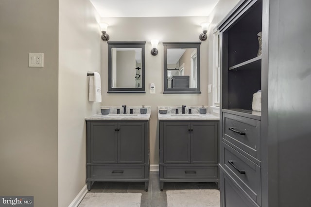 3313 Midland Rd, Fairfax, VA 22031 - bathroom with a sink, baseboards, tile patterned flooring, and two vanities