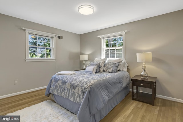 3313 Midland Rd, Fairfax, VA 22031 - bedroom featuring baseboards, wood finished floors, and visible vents