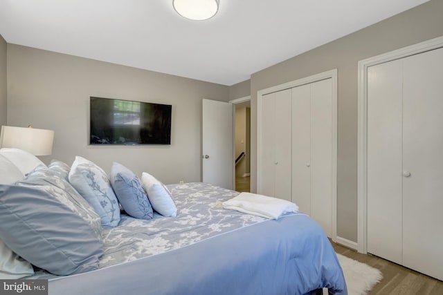 3313 Midland Rd, Fairfax, VA 22031 - bedroom featuring multiple closets and wood finished floors