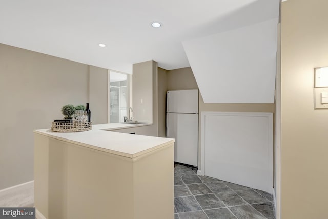 3313 Midland Rd, Fairfax, VA 22031 - kitchen with freestanding refrigerator, a peninsula, recessed lighting, light countertops, and a sink
