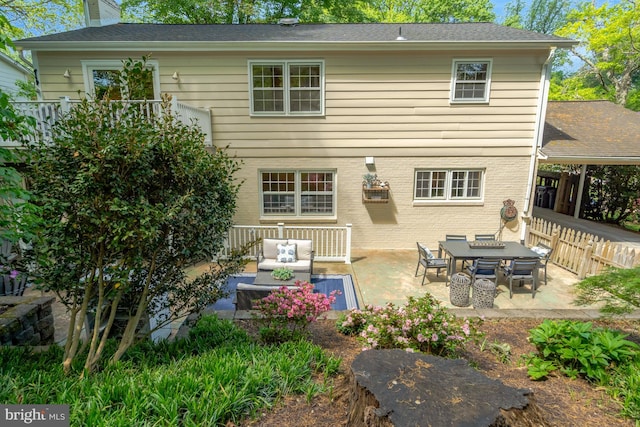 3313 Midland Rd, Fairfax, VA 22031 - rear view of property featuring a patio, fence, a chimney, and outdoor lounge area