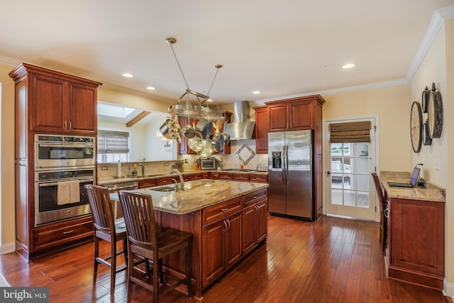 14926 Victory Ln, Glenelg, MD 21737 - kitchen featuring a sink, dark wood-style floors, stainless steel appliances, wall chimney range hood, and decorative backsplash