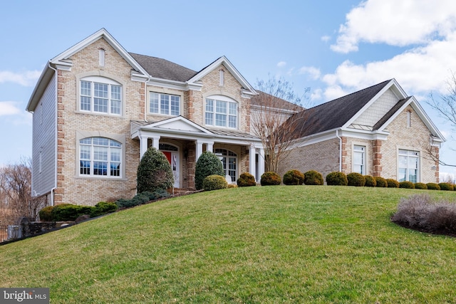 14926 Victory Ln, Glenelg, MD 21737 - traditional-style house with brick siding and a front yard