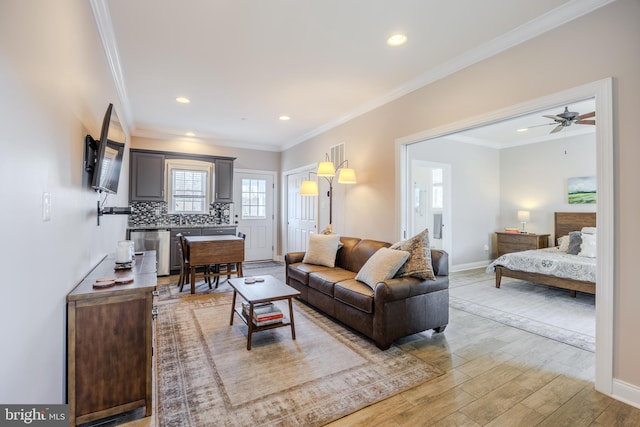 14926 Victory Ln, Glenelg, MD 21737 - living room with light wood finished floors, baseboards, crown molding, and recessed lighting