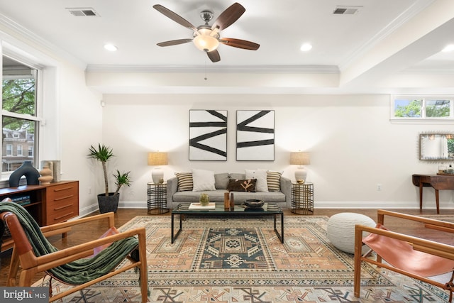 living room with wood finished floors, a ceiling fan, baseboards, crown molding, and recessed lighting