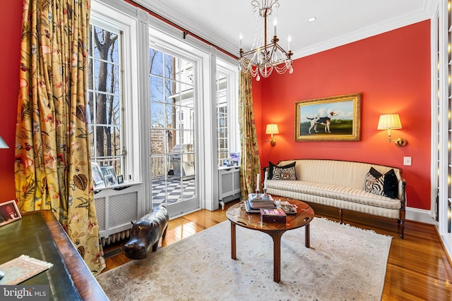 24 Whitfield Rd, Baltimore, MD 21210 - living area with a chandelier, hardwood / wood-style floors, baseboards, and ornamental molding