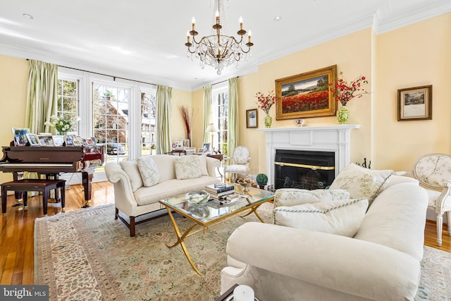 24 Whitfield Rd, Baltimore, MD 21210 - living area with plenty of natural light, wood finished floors, an inviting chandelier, and ornamental molding