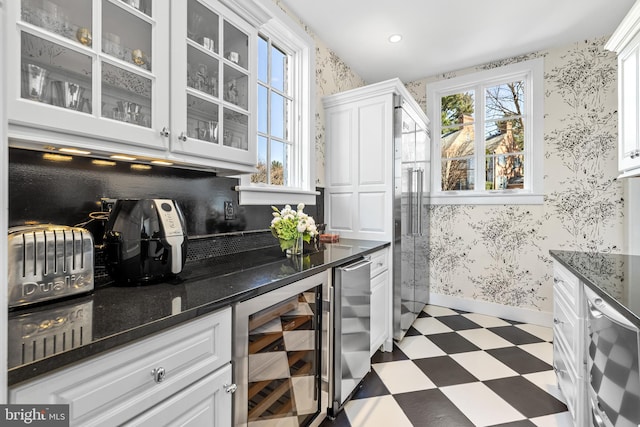 24 Whitfield Rd, Baltimore, MD 21210 - kitchen with beverage cooler, light floors, and wallpapered walls