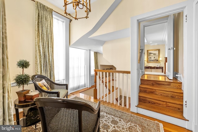 24 Whitfield Rd, Baltimore, MD 21210 - living area with a chandelier, plenty of natural light, stairs, and wood finished floors