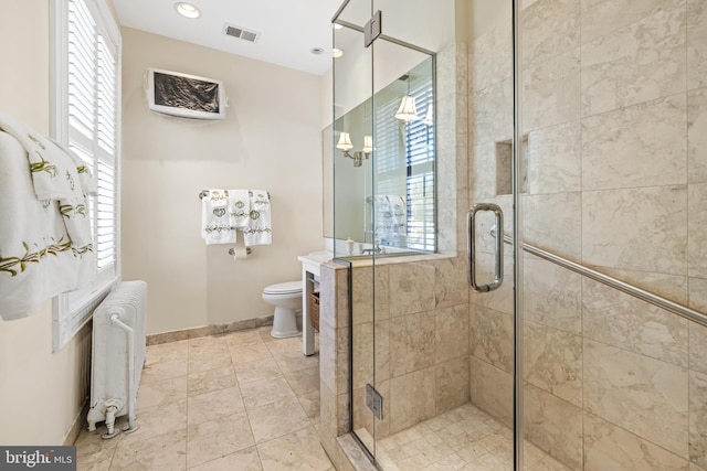 24 Whitfield Rd, Baltimore, MD 21210 - bathroom featuring visible vents, baseboards, radiator, and a stall shower