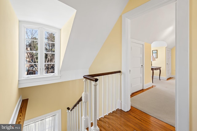 24 Whitfield Rd, Baltimore, MD 21210 - hallway featuring an upstairs landing, baseboards, lofted ceiling, and wood finished floors