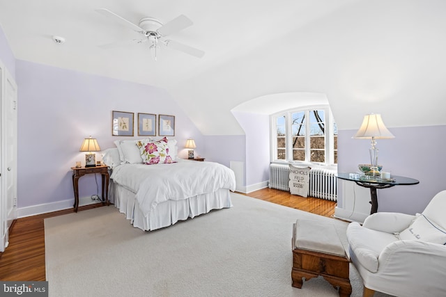 24 Whitfield Rd, Baltimore, MD 21210 - bedroom featuring baseboards, radiator heating unit, lofted ceiling, and wood finished floors