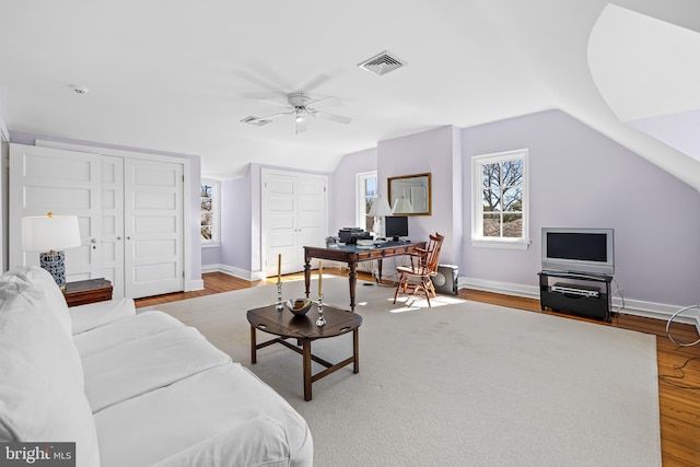 24 Whitfield Rd, Baltimore, MD 21210 - living room featuring visible vents, a ceiling fan, wood finished floors, baseboards, and lofted ceiling