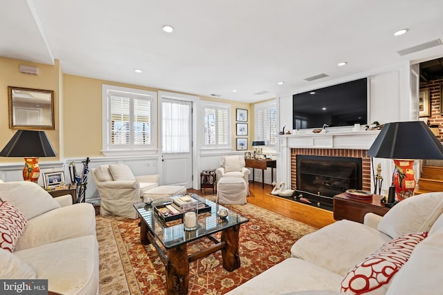 24 Whitfield Rd, Baltimore, MD 21210 - living area featuring recessed lighting, a brick fireplace, and wood finished floors