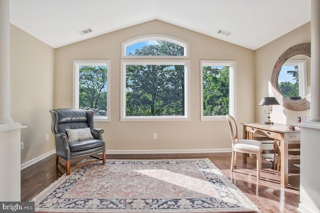 sitting room featuring wood finished floors, vaulted ceiling, and baseboards
