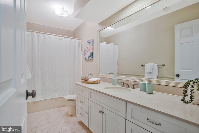 full bath featuring vanity, toilet, tile patterned floors, and shower / bath combination with curtain