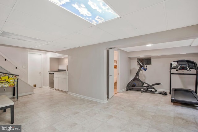 finished basement featuring baseboards and light floors