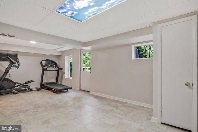 exercise area featuring plenty of natural light and baseboards