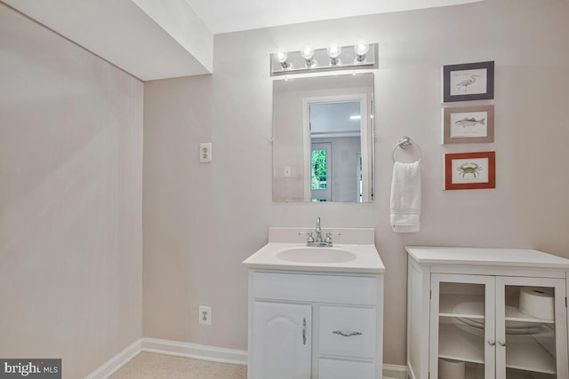 bathroom featuring vanity and baseboards