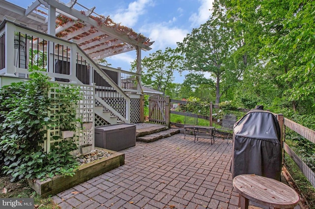 view of patio featuring stairway, a pergola, and a deck