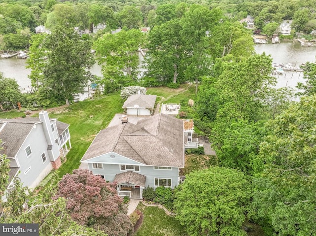 aerial view of property and surrounding area with a nearby body of water