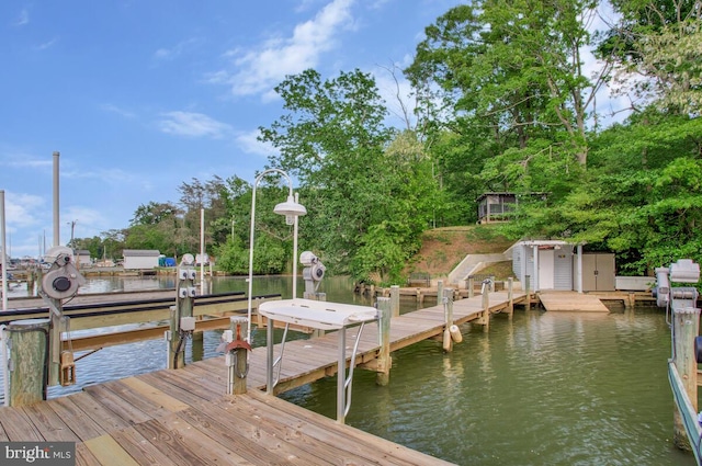 dock area featuring a water view and boat lift