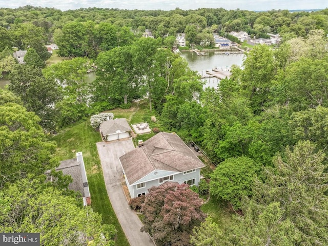 bird's eye view of a large body of water and a heavily wooded area
