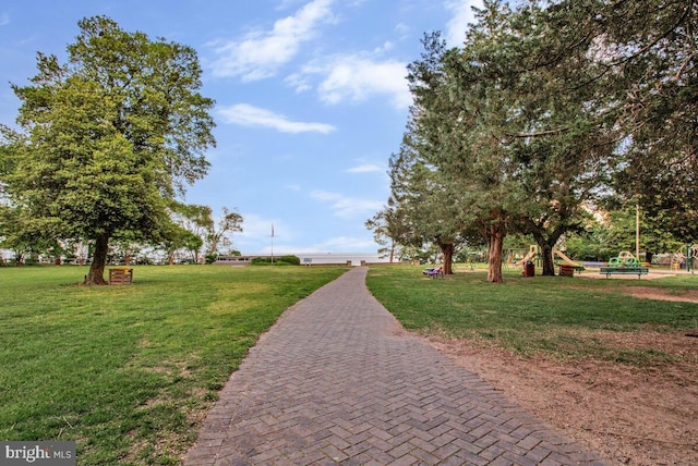 view of home's community featuring a lawn