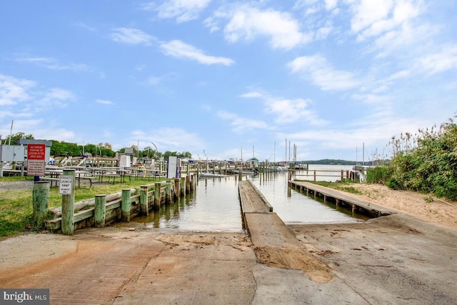 dock featuring a boat ramp and a water view