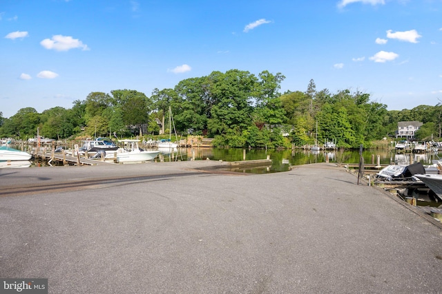 743 Rolling View Dr, Annapolis, MD 21409 - view of asphalt road with a water view and view of wooded area
