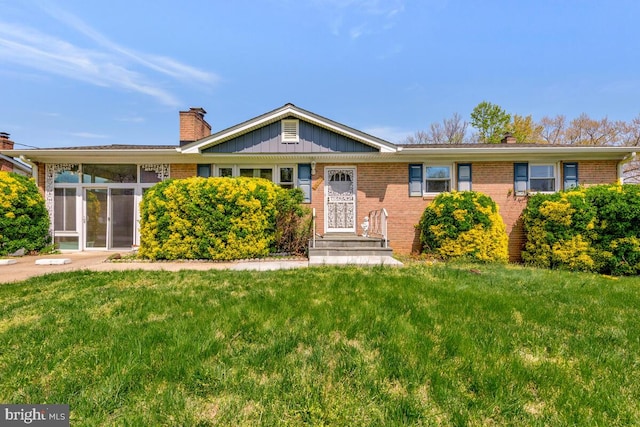 8008 Daniel Dr, District Heights, MD 20747 - single story home featuring board and batten siding, a chimney, a front lawn, and brick siding