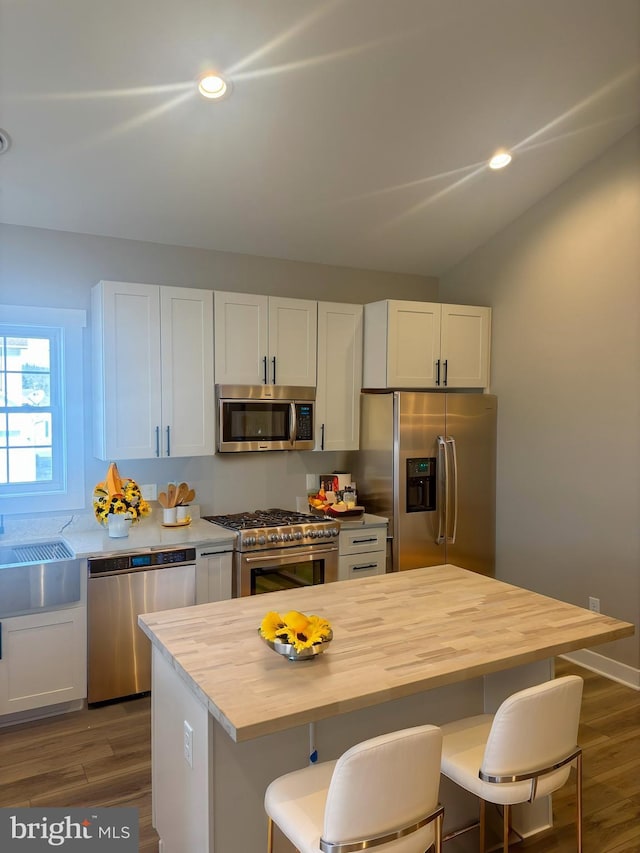 202 Moonlight Dr, Frostburg, MD 21532 - kitchen with dark wood-type flooring, white cabinets, appliances with stainless steel finishes, and wooden counters