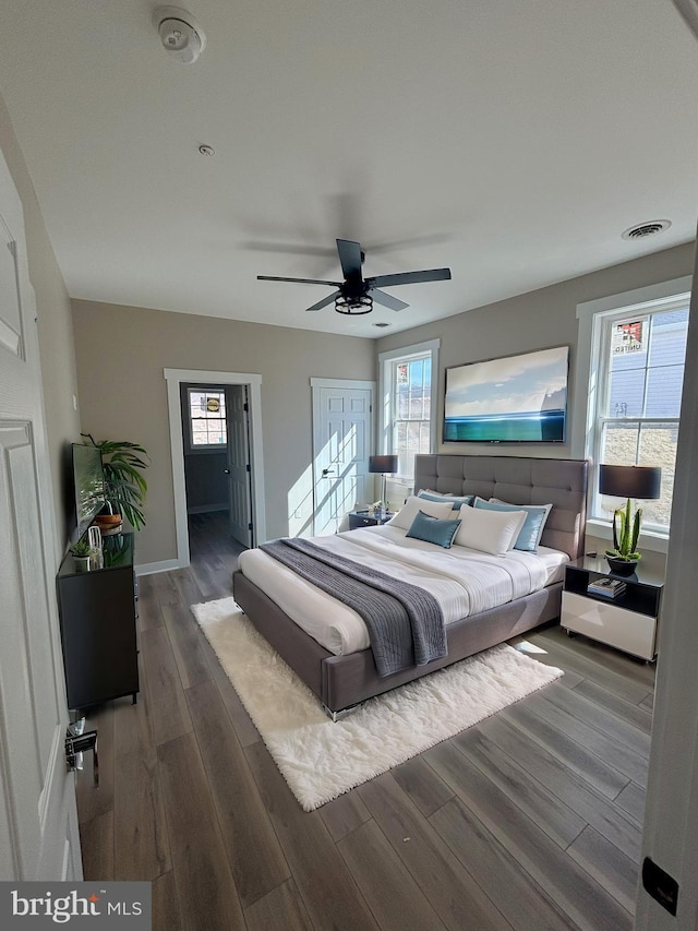 202 Moonlight Dr, Frostburg, MD 21532 - bedroom featuring visible vents, multiple windows, a ceiling fan, and wood finished floors
