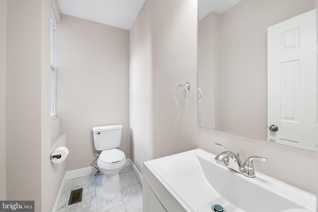 738 N Patterson Park Ave, Baltimore, MD 21205 - bathroom featuring visible vents, baseboards, toilet, marble finish floor, and vanity