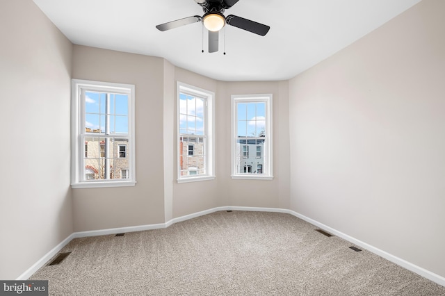738 N Patterson Park Ave, Baltimore, MD 21205 - empty room featuring visible vents, ceiling fan, baseboards, and carpet