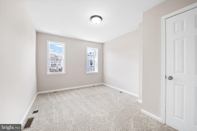 738 N Patterson Park Ave, Baltimore, MD 21205 - carpeted spare room featuring visible vents and baseboards