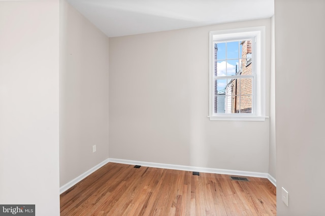 738 N Patterson Park Ave, Baltimore, MD 21205 - unfurnished room featuring visible vents, baseboards, and wood finished floors